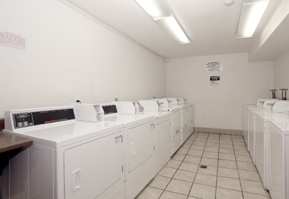 the laundry room is equipped with washers and dryers
