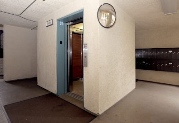 an empty room in a building with an open door