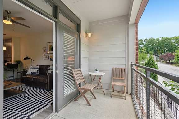 A patio with a table and chairs is shown.