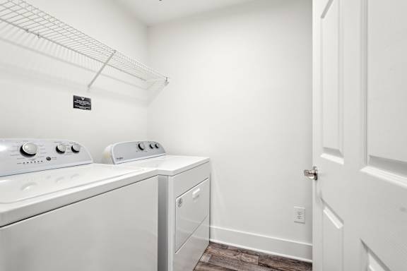 A laundry room with a washer and dryer.