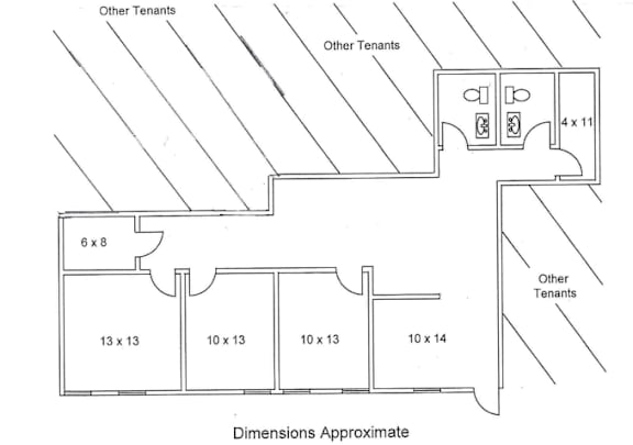 a floorplan image of an available office space with 1,310 square feet and bathrooms