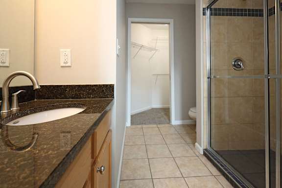Granite Countertops and Porcelain Tile in the Bathrooms and Kitchen at The Residences at 668 Apartments, Ohio