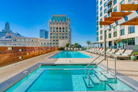 A large swimming pool with steps leading into it.