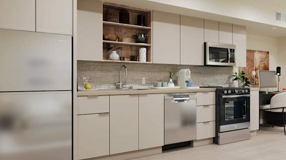 A modern kitchen with stainless steel appliances and white cabinets at Skyview Sunset Apartments, Los Angeles 90046