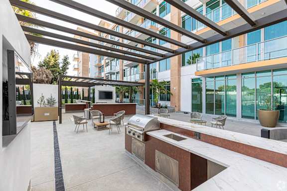 Patio with Barbecue Grill at Casa Estilo Apartments, California