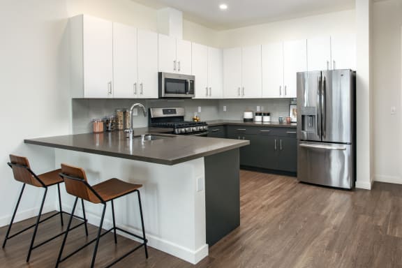 fully equipped kitchen with GE stainless steel energy efficient  appliances at Imperial Hardware Lofts, Riverside, 92501