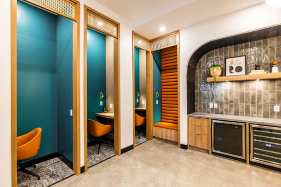 a conference room with blue walls and orange chairs