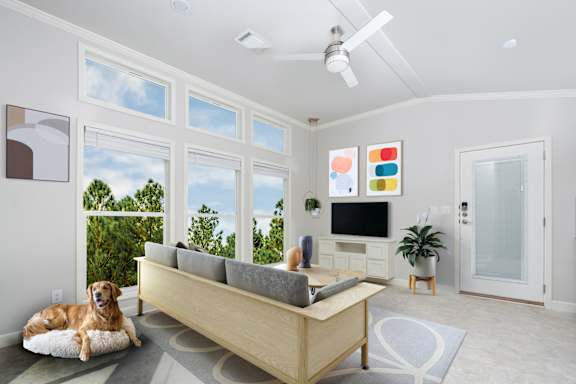 A dog is lying on a dog bed in a living room.