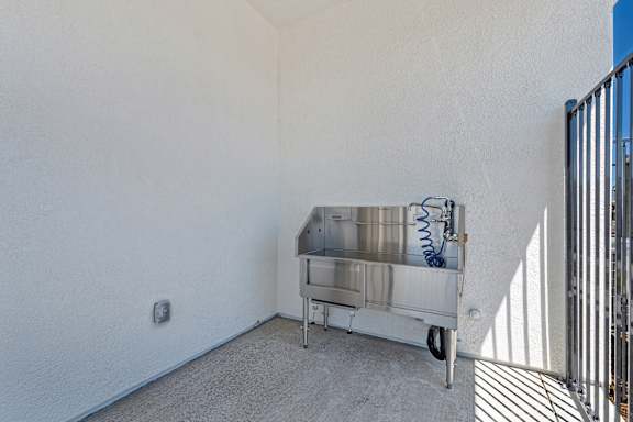 Stainless steel pet grooming station on wheels at Estia Roseville Apartments, California, 95747