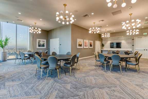 A conference room with a long table and chairs.