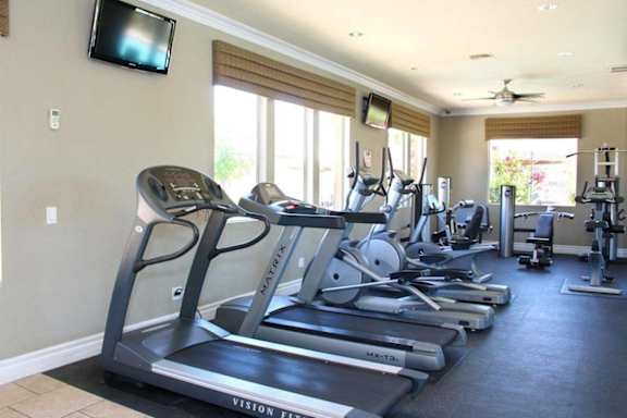 A gym with treadmills and exercise equipment at Avalon at Seven Hills Apartments, Henderson, NV, 91790
