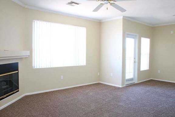A room with a fireplace and a ceiling fan at Avalon at Seven Hills Apartments, Nevada, 91790