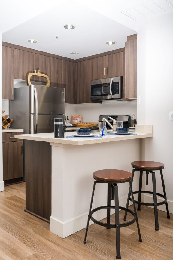 Well Equipped Kitchen And Dining at The Preston Miracle Mile Apartments, California, 90036