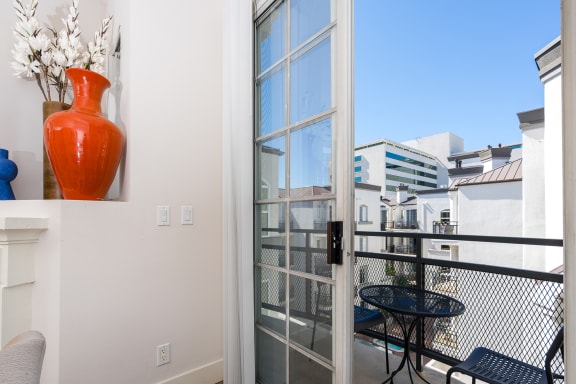 Living Room With Private Balcony at The Preston Miracle Mile Apartments, Los Angeles, 90036