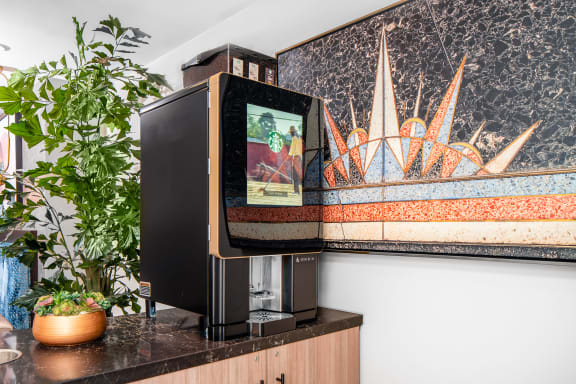 Coffee machine in business and living lounge at The Preston Miracle Mile Apartments, Los Angeles