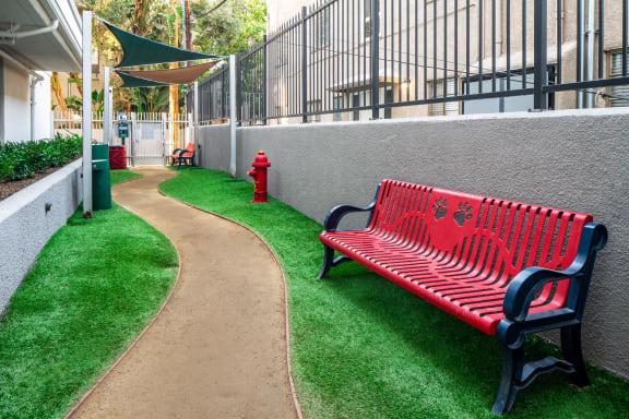 Pet Park with a Bench at The Preston Miracle Mile Apartments, Los Angeles, California