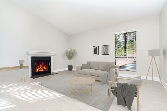 a living room with a couch and a fireplace at Ridgecrest, Lake Forest
