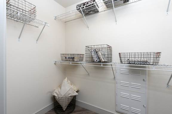 A white laundry room with a washer and dryer.