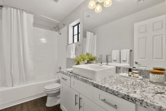 a bathroom with a sink and a toilet and a shower at Vaseo Apartments, Phoenix, 85022