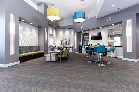 A conference room with a long table and chairs at Nola 624 Apartments, West Covina, 91790