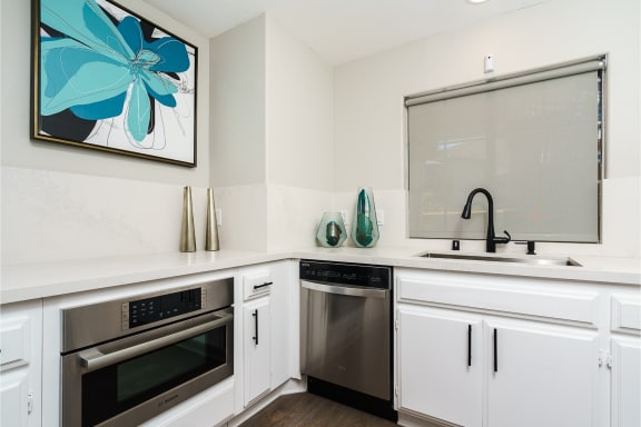a kitchen with white cabinets and stainless steel appliances at Westlake Canyon, Thousand Oaks, CA 91362