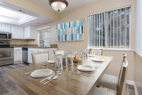 Dining and kitchen area with hardwood-style flooring at Westlake Canyon, Thousand Oaks, California