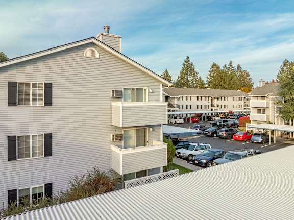 A modern house with a parking lot in front. at Ironwood Apartments, Coeur dAlene, Idaho