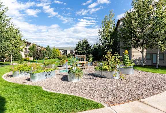 Community garden with galvanized planter beds at Mullan Reserve Apartments, Missoula, Montana