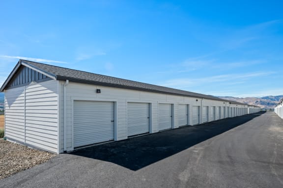 a row of garage doors on the side of a buildingat Gateway Apartments, East Wenatchee , WA 98802