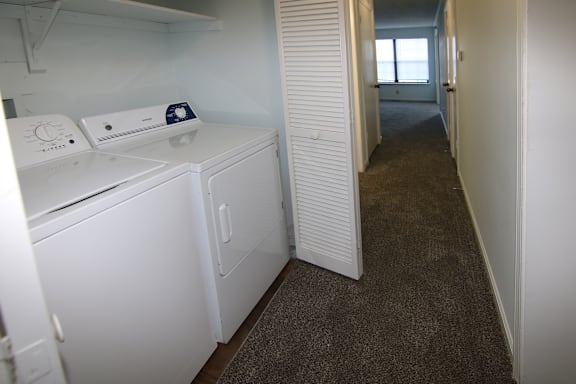 A laundry room with a washer and dryer.