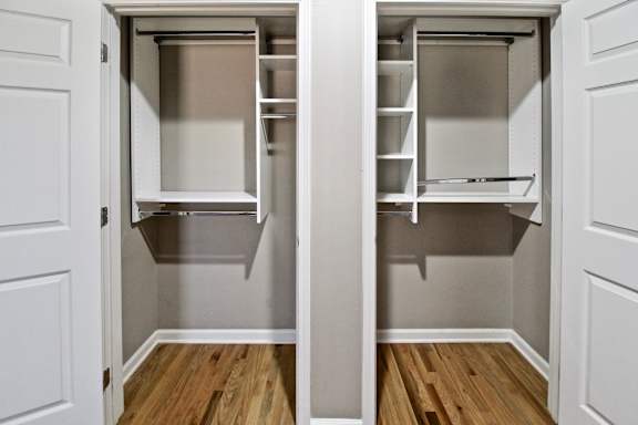 A white door with a small kitchen inside.