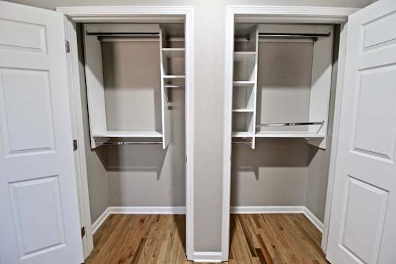 A white door with a small open section revealing a shelf.
