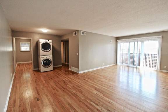 A room with a washer and dryer in it.