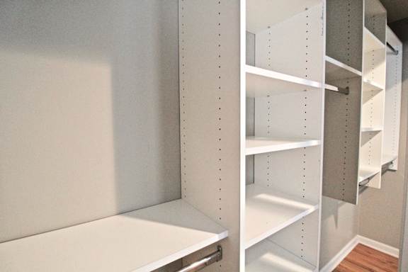 A white shelving unit with multiple shelves.