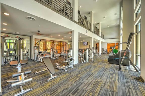 a room filled with lots of different types of exercise equipment  at Fusion, Jacksonville, FL, 32256