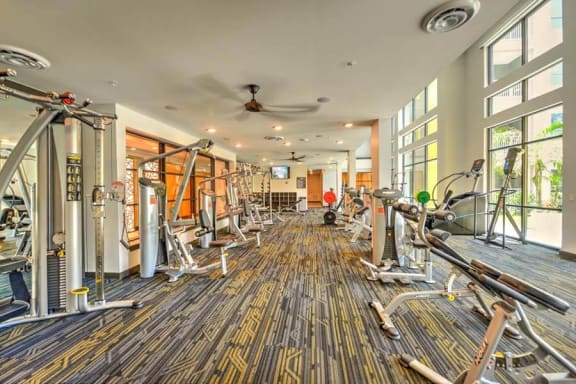 a room filled with lots of different types of exercise equipment  at Fusion, Jacksonville, Florida