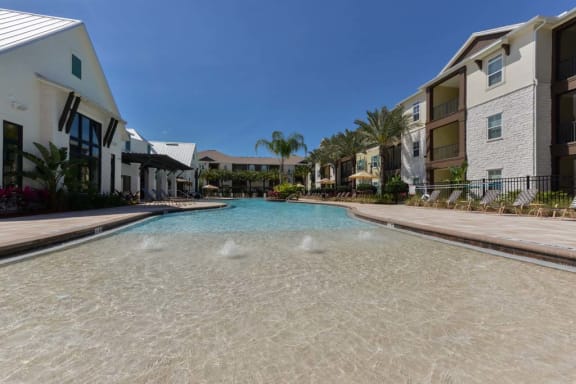 a large swimming pool in front of a building  at Cabana Club - Galleria Club, Jacksonville