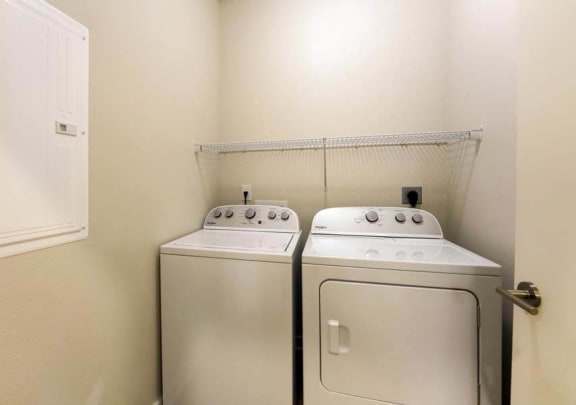 a washer and dryer in a room  at Fusion, Florida