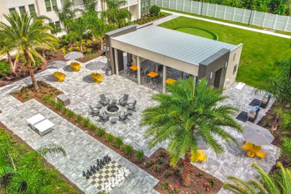 a backyard with a pavilion and palm trees  at Fusion, Florida, 32256