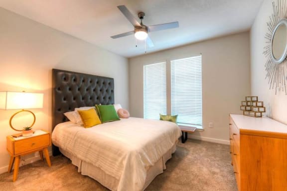 a bedroom with a large bed and a ceiling fan  at Fusion, Jacksonville, FL, 32256