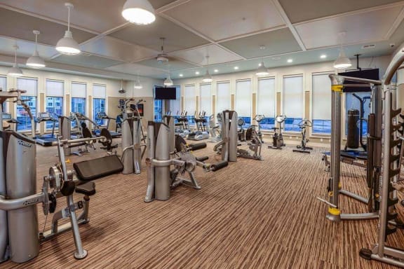 a room filled with lots of different types of exercise equipment  at Palm Bay Club, Florida, 32258