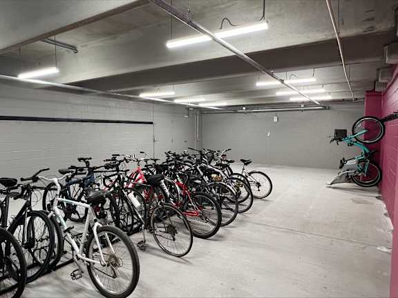a bunch of bikes parked in a parking garage at Pinnacle Apartments, Jacksonville, 32256