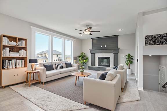 A living room with a fireplace and a couch.