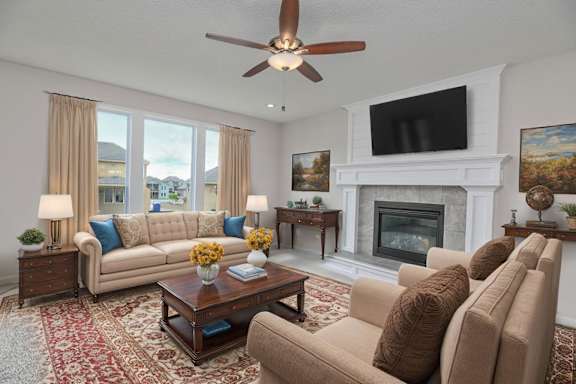 A living room with a fireplace, two couches, and a television.
