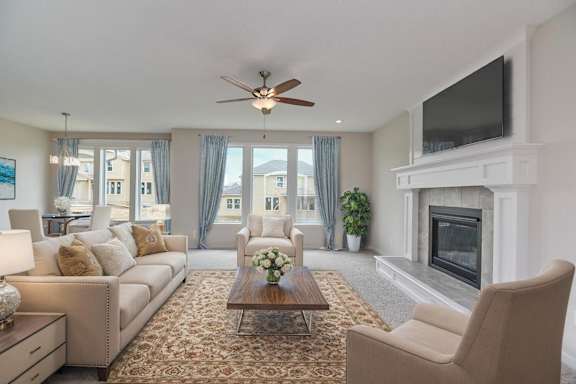 A living room with a fireplace and a television mounted on the wall.