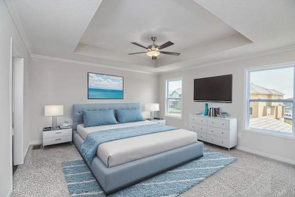 A bedroom with a large bed and a ceiling fan.