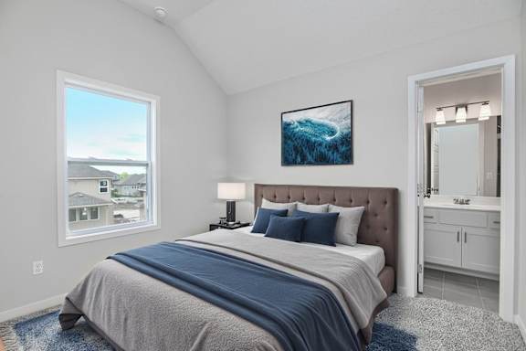A bedroom with a large bed and a painting on the wall.