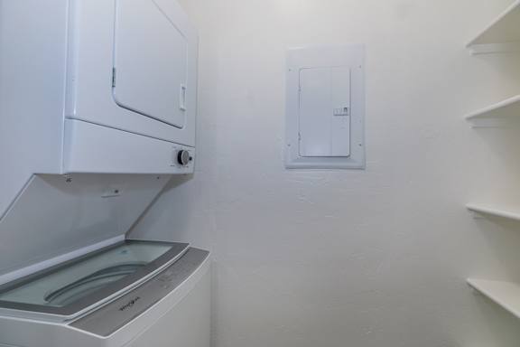 A white oven and microwave in a kitchen.