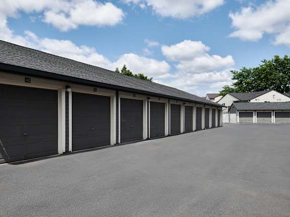 A long row of garage doors are closed.