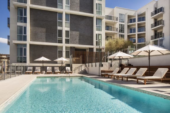 Apartments in Hollywood CA - The Fifty Five Fifty - Sparkling Pool Surrounded by Lounge Seating